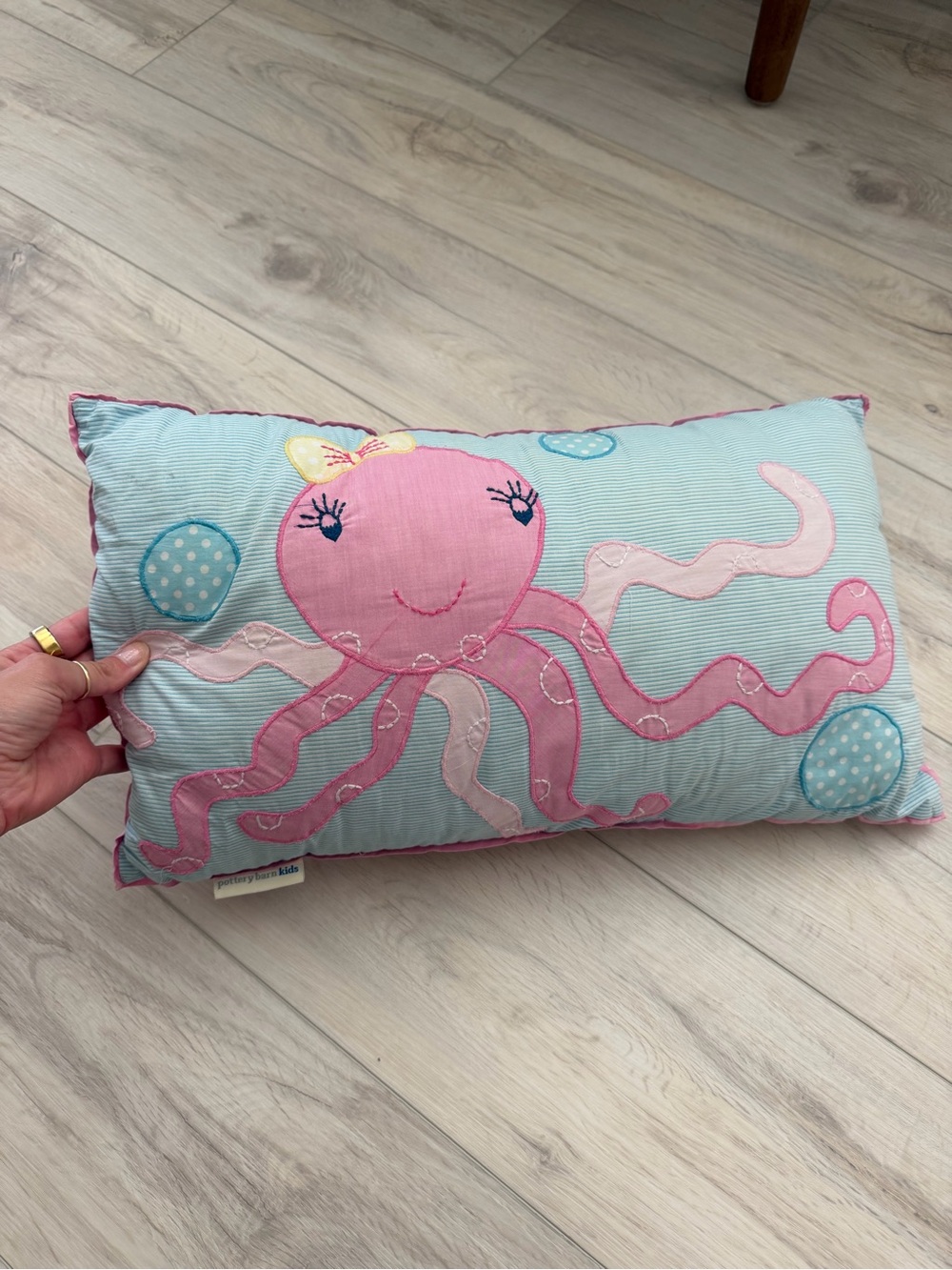 Pottery Barn Kids Pink Octopus Appliqué Pillow with Light Blue Background
